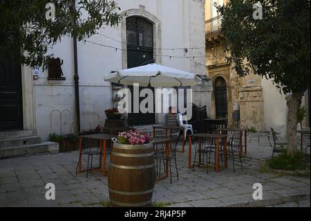 Local Sicilian bistro patio on Via Mormino Penna in Scicli Sicily, Italy. Stock Photo