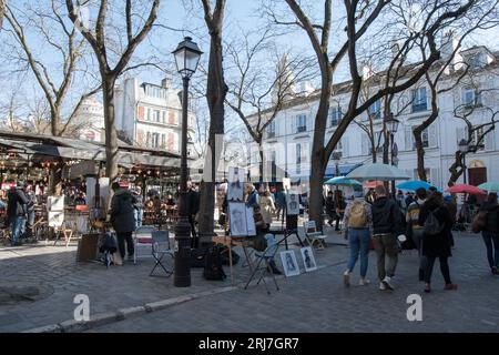 People and artists at iconic Place du Tertre in Montmartre Stock Photo