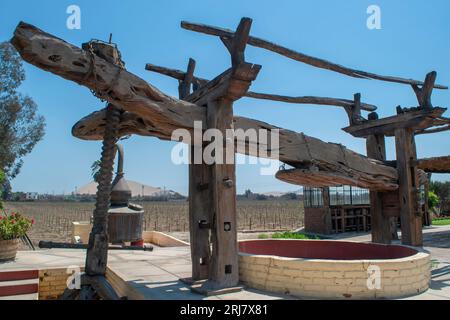 Old wooden wine press at Ica, Peru Stock Photo