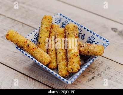 Battered and fried mozzarella sticks Stock Photo