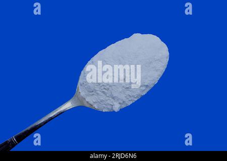 Home baking ingredients: Self raising white flour set against a blue background with copy space. Stockfoto