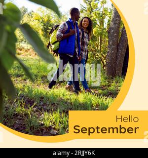 Komposition aus Hello-september-Text über ein birassisches Paar im Garten Stockfoto