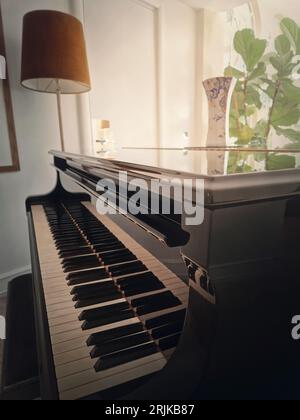 Vintage piano in a cozy room Stock Photo