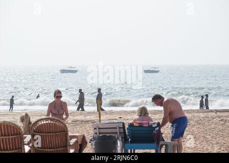 Calangute, Goa, India - January 2023: A view of fishing boats on the sea from a tourist beach shack in Calangute. Stock Photo