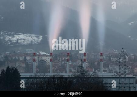 Smoke coming out of chimneys of heating plant at evening, Borik settlement in Banja Luka Stock Photo