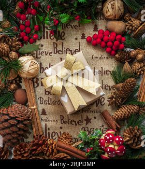 Christmas themed flat lay around a wrapped present Stock Photo