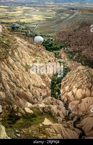 Göreme, Turkey -June 26 2022: flight of balloons over the valleys of Cappadocia. Stock Photo