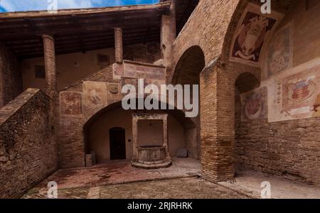 Frescoes in the courtyard of the Palazzo del Popolo, Piazza del Duomo, San Gimignano Tuscany, Italy, Europe Stock Photo