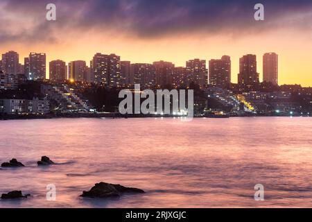 Skyline of buildings in Concon at sunset, Valparaiso Region, Chile Stock Photo