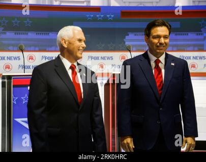 Milwaukee, United States. 23rd Aug, 2023. Republican presidential candidate Mike Pence (L) stands by Republican presidential candidate Ron DeSantis (R) as they take the stage at the first Republican presidential candidate debate of the 2024 presidential race at Fiserv Forum in Milwaukee, Wisconsin, August 23, 2023. Fiserv Forum will will be the site of the Republican National Convention July 15-18, 2024 where the Republican presidential candidate will be nominated. Photo by Tannen Maury/UPI Credit: UPI/Alamy Live News Stock Photo