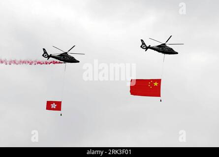 Bildnummer: 53478267  Datum: 01.10.2009  Copyright: imago/Xinhua (091001) -- HONG KONG, Oct. 1, 2009 (Xinhua) -- Two helicopters fly with Chinese national flag and the flag of Hong Kong Special Administrative Region during the flag-raising ceremony held in south China s Hong Kong SAR, Oct. 1, 2009.all around China celebrate the 60th anniversary of the founding of the Republic of China on Thursday. (Xinhua/Chen Duo) (yc) CHINA-NATIONAL DAY-CELEBRATIONS-HONG KONG (CN) PUBLICATIONxNOTxINxCHN Nationalfeiertag 60 Jahre Volksrepublik China Militär Luftwaffe kbdig xsk 2009 quer o0 Hongkong o00 Hubsch Stock Photo