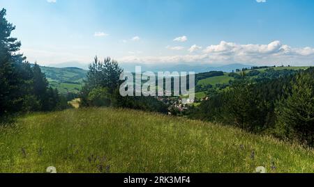 Lucka and Kalameny villages with rolling landscape with smaller hills around in Slovaki during beautiful summer day Stock Photo