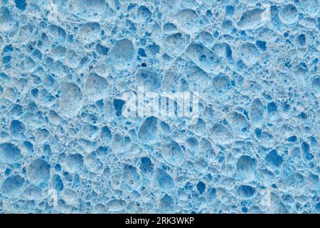 Hintergrund mit blauer Schwammstruktur für Design. Draufsicht auf Poren und Schwammgewebe. Stockfoto