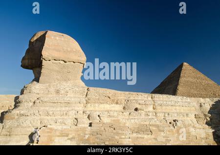 Sphinx and Great pyramiid of Giza in Egypt. Gods of Egypt in stone and bricks Stock Photo