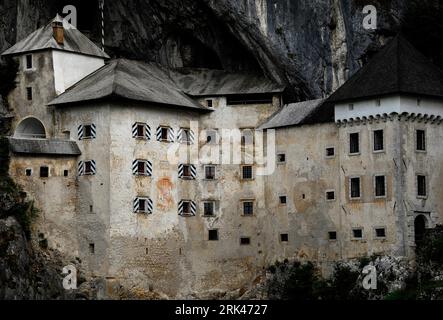 Renaissance facade of 800-year-old Predjama Castle in south-west Slovenia, an impregnable fortress built in the mouth of a cavern. Stock Photo