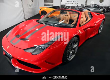 Three-quarters front view of a Red, 2016, Ferrari 458 Speciale Aperta  on the Premier GT Stand, at the 2023 British Motor Show, Farnborough Stock Photo
