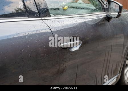 wet car door after rain or washing Stock Photo