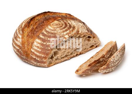 Traditional homemade loaf of sourdough bread and slices isolated on white background close up Stock Photo