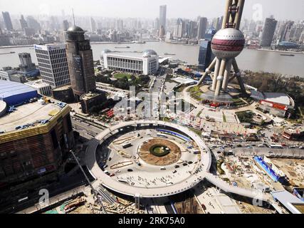 Bildnummer: 53863846  Datum: 17.03.2010  Copyright: imago/Xinhua  Photo taken on March 17, 2010 shows the newly-completed loop Pedestrian Overpass in the Lujiazhui financial and trade area, in Pudong of Shanghai, east China. The loop Pedestrian Overpass, located beside the Oriental Pearl Television Tower, with a perimeter of 370 meters and 4 outlets and equipped with stairways, escalator and elevator for the handicapped, is expected to be opened to public prior to the opening of 2010 Shanghai World Expo. (Xinhua) (px) (3)CHINA-SHANGHAI-ORIENTAL PEARL TOWER-PEDESTRIAN OVERPASS-COMPLETION(CN) PU Stock Photo