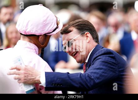 Jockey James Doyle (left) celebrates with horse trainer Aidan O'Brien after winning the Pertemps Network Yorkshire Oaks on Warm Heart on day two of the Sky Bet Ebor Festival at York Racecourse. Picture date: Thursday August 24, 2023. Stock Photo