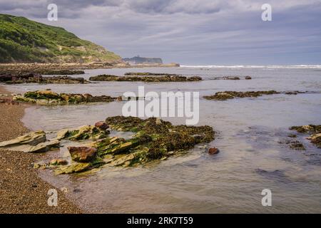 View from the beach in Cornelian Bay looking north towards Scarborough which can just be seen in the distance. Stock Photo