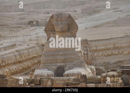 Giza, Cairo, Egypt - 05 02 2011: famous giant statue of the great Spinx at the Pyramids in Giza, a popular travel destination and unesco heritage. Stock Photo