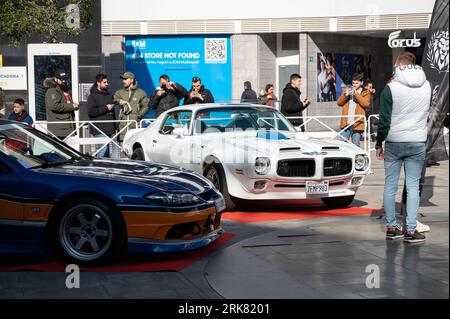 white Pontiac Firebird Trans Am 455 HO Interceptor and a Nissan Silvia S15 Stock Photo