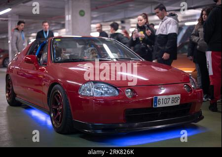 Front view of a red with blue neon Honda Civic CR-X Del Sol tuned by Mugen at a parking rally Stock Photo