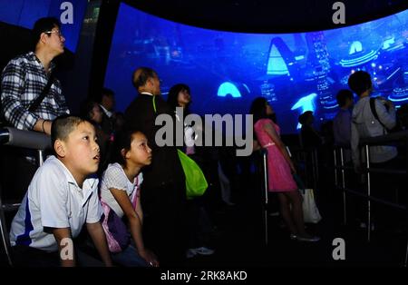 Bildnummer: 54006678  Datum: 01.05.2010  Copyright: imago/Xinhua (100501) -- SHANGHAI, May 1, 2010 (Xinhua) -- Visitors watch circular-screen movie at China Shipbuilding Industry Corporation Pavilion in the World Expo Park in Shanghai, east China, May 1, 2010. China Shipbuilding Industry Corporation Pavilion, the largest corporation pavilion of 2010 Shanghai World Expo located in Zone E, opened to public on Saturday. The pavilion is reconstructed from an old factory and adds a new structure to the former plant.With the theme of Shipbuilding creates a better city life , the pavilion display the Stock Photo