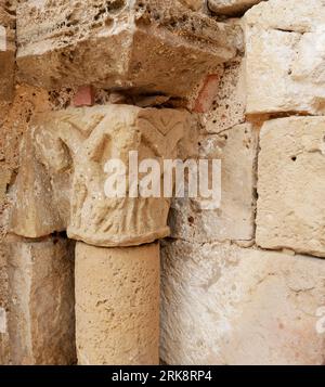 Stone carved ornament on a column at the entrance of the church in Payroux Stock Photo