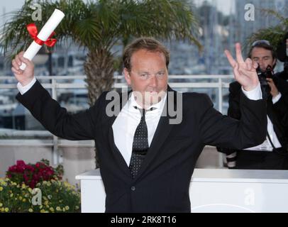 French director Xavier Beauvois (Großer Preis der Jury) poses after winning the Grand Prix award for his film Of God and Men during the closing ceremony at the 63rd Cannes Film Festival in France, May 23, 2010. (Xinhua/Xiao He) (yc) (18)FRANCE-FILM-FESTIVAL-CANNES PUBLICATIONxNOTxINxCHN   French Director Xavier Beauvois grand Prize the Jury Poses After Winning The Grand Prix Award for His Film of God and Men during The CLOSING Ceremony AT The 63rd Cannes Film Festival in France May 23 2010 XINHUA Xiao he yc 18 France Film Festival Cannes PUBLICATIONxNOTxINxCHN Stock Photo