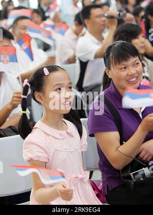 Bildnummer: 54180190  Datum: 27.06.2010  Copyright: imago/Xinhua (100627) -- SHANGHAI, June 27, 2010 (Xinhua) -- Chinese visitors wave Serbian national flags while watching performances given by Serbian artists during a ceremony marking the Serbia National Pavilion Day at the Shanghai World Expo in Shanghai, east China, June 27, 2010. (Xinhua/Fan Jun) (dyw) WORLD EXPO-SERBIA-NATIONAL PAVILION DAY (CN) PUBLICATIONxNOTxINxCHN Wirtschaft Gesellschaft Expo kbdig xcb 2010 hoch     Bildnummer 54180190 Date 27 06 2010 Copyright Imago XINHUA  Shanghai June 27 2010 XINHUA Chinese Visitors Wave Serbian Stock Photo