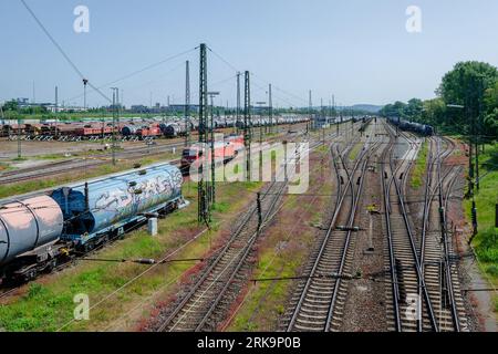 Railway tracks. There are freight wagons and cisterns on the tracks. Stock Photo