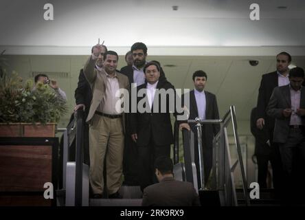 (100715) -- TEHRAN, July 15, 2010 (Xinhua) -- Iranian scholar Shahram Amiri (front, L) arrives at the airport in Tehran, July 15, 2010. Shaharm Amiri, 32, who arrived in Tehran early in the morning, told a news conference that he was kidnapped by the CIA and the abduction was part of the U.S. campaign to add political pressures to Iran. (Xinhua/Ahmad Halabisaz) (gj) (11)IRAN-SCHOLAR-SHAHRAM AMIRI-RETURN PUBLICATIONxNOTxINxCHN Stock Photo