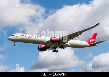 Virgin Atlantic Airways Airbus A350 jet airliner plane on finals to land at London Heathrow Airport, UK. Named Rosie Lee. Side view Stock Photo