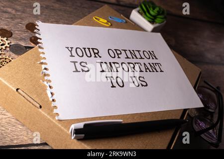 text Your Opinion is important to us on white paper. Stock Photo