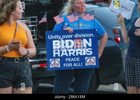 Milwaukee, Wisconsin, USA - August 23, 2023: A supporter of President Joe Biden holds a protest sign at the entrance to the first 2024 Republican Presidential Debate. Stock Photo