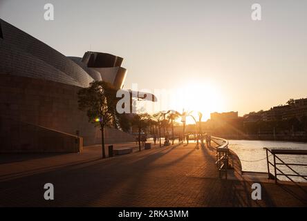 Bilbao, Spain - August 02, 2022: Awesome evening panoramic view of The Guggenheim Museum designed by Frank Gehry at golden hour Stock Photo