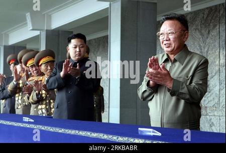 101010 -- PYONGYANG, Oct. 10, 2010 Xinhua -- Kim Jong Il 1st R, top leader of the Democratic People s Republic of Korea DPRK, and Kim Jong Un 2nd R, vice-chairman of the Central Military Commission of the Workers Party of Korea WPK, applaud before a grand military parade to celebrate the 65th anniversary of the founding of the WPK, in Pyongyang, Oct. 10, 2010. Xinhua/Yao Dawei xzj DPRK-PYONGYANG-PARADE PUBLICATIONxNOTxINxCHN Stock Photo