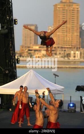 Bildnummer: 54585769  Datum: 29.10.2010  Copyright: imago/Xinhua (101030) -- DOHA, Oct. 30, 2010 (Xinhua) -- Members of the Polish Modern Circus Troupe Cirque Apeiron perform during the Family Day Festivities on the third day of Doha Tribeca Film Festival (DTFF) at Katara Open Air Theatre in Doha, Oct. 29, 2010. (Xinhua/Maneesh Bakshi) QATAR-DTFF-FAMILY DAY FESTIVITIES PUBLICATIONxNOTxINxCHN Gesellschaft Festival kbdig xcb 2010 hoch     Bildnummer 54585769 Date 29 10 2010 Copyright Imago XINHUA  Doha OCT 30 2010 XINHUA Members of The Polish Modern Circus Troupe Cirque Apeiron perform during Th Stock Photo