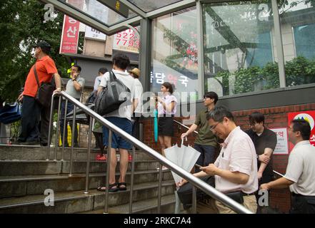 Civil defence drill, Aug 23, 2023 : People take shelter at a subway exit after the air-raid alarm during a civil defence drill in Seoul, South Korea. Credit: Lee Jae-Won/AFLO/Alamy Live News Stock Photo