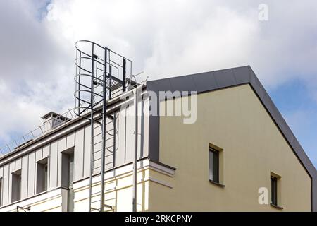 old industrial building with outdoor fire escape after renovation works Stockfoto