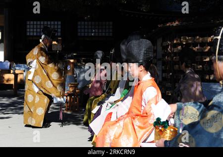 Bildnummer: 54797723  Datum: 10.01.2011  Copyright: imago/Xinhua (110110) -- TOKYO, Jan. 10, 2011 (Xinhua) -- Staff members and youths attend the Genpuku ceremony held in Meiji Shrine in Tokyo, capital of Japan, on Jan. 10, 2010, the Coming of Age Day. The Coming of Age Day is a Japanese holiday held annually on the second Monday of January, which is held in order to congratulate and encourage all those who have reached 20 years old over the past year. Meiji Shrine hold an historical Japannese coming of age ceremony named Genpuku on the Coming of Age Day every year. (Xinhua/Ji Chunpeng) (lyi) Stock Photo