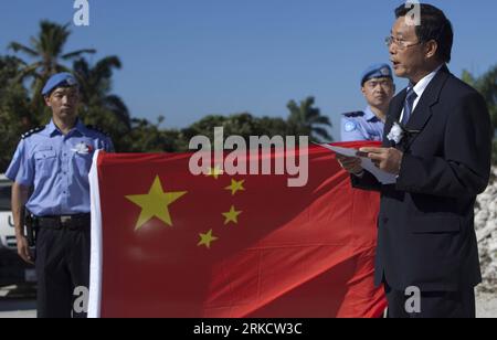 Bildnummer: 54809407  Datum: 12.01.2011  Copyright: imago/Xinhua (110112) -- PORT-AU-PRINCE, Jan. 12, 2011 (Xinhua) -- Wang Shuping (R), representative of the commercial development office of China in Haiti, speaks at a ceremony mourning for the eight Chinese peacekeeping police officers who died in the Haiti earthquake a year ago, in front of the rubbles of the UN Stabilization Mission in Haiti (MINUSTAH) headquarters in Port-au-Prince, Haiti, Jan. 12, 2011. (Xinhua/Eliana Aponte) (zw) HAITI-PORT-AU-PRINCE-EARTHQUAKE-ANNIVERSARY-CHINA-MOURNING PUBLICATIONxNOTxINxCHN Gesellschaft Politik Natur Stock Photo