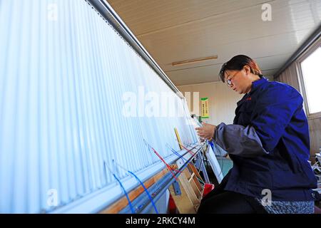 Luannan County - December 13, 2018: Technicians make electric heaters, Luannan County, Hebei Province, China Stock Photo