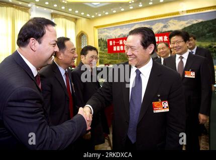 Bildnummer: 55014442  Datum: 11.03.2011  Copyright: imago/Xinhua (110311) -- BEIJING, March 11, 2011 (Xinhua) -- Zhou Yongkang (R, Front), a member of the Standing Committee of the Political Bureau of the Communist Party of China (CPC) Central Committee and also the secretary of the Commission for Political and Legal Affairs of the CPC Central Committee, visits deputies to the Fourth Session of the 11th National People s Congress (NPC) from northwest China s Xinjiang Uygur Autonomous Region and joins their panel discussion in Beijing, capital of China, March 11, 2011. (Xinhua/Huang Jingwen) (l Stock Photo