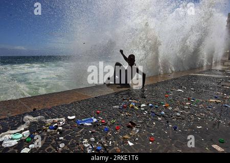 Bildnummer: 55037054  Datum: 16.03.2011  Copyright: imago/Xinhua (110317) -- RIO DE JANEIRO, March 17, 2011 (Xinhua) -- A wave hits a young man at Arpoador Beach, in Rio de Janeiro, Brazil, on March 16, 2011. Strong winds and an extratropical cyclone created rough seas off the southeast coast of Brazil. (Xinhua/Agencia Estado)(BRAZIL OUT) (ce) BRAZIL-RIO DE JANEIRO-WEATHER-SURGE PUBLICATIONxNOTxINxCHN Gesellschaft Sturm Küste kbdig xub 2011 quer premiumd  o0 Brandung, Junge, Kind    Bildnummer 55037054 Date 16 03 2011 Copyright Imago XINHUA  Rio de Janeiro March 17 2011 XINHUA a Wave Hits a Yo Stock Photo