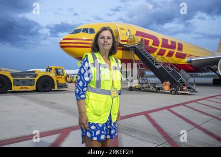 Zaventem, Belgium. 24th Aug, 2023. DHL Managing Director Belgium Kirsten Carlier poses for the photographer during the hub of logistics firm DHL at Brussels Airport, Thursday 24 August 2023 in Zaventem. DHL is inviting journalists for a guided tour to stress night flights are essential in their daily functioning, despite noise pollution complaints. BELGA PHOTO HATIM KAGHAT Credit: Belga News Agency/Alamy Live News Stock Photo