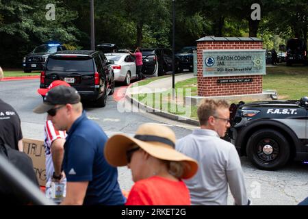 Atlanta, USA. 24th Aug, 2023. People gather outside the Fulton County Jail in Atlanta, Georgia, the United States, Aug. 24, 2023. Former U.S. President Donald Trump turned himself in on Thursday to the authorities in Atlanta for the Georgia election interference case. Credit: Matthew Pendry/Xinhua/Alamy Live News Stock Photo