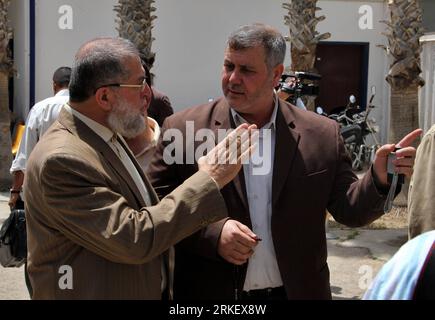 Bildnummer: 55308843  Datum: 02.05.2011  Copyright: imago/Xinhua (110502) -- GAZA, May 2, 2011 (Xinhua) -- Palestinian officials of Islamic Jihad movement Ramadan Shalah (R) and Nafez Azam (L) leave for Egypt through Rafah border crossing in southern Gaza Strip, May 2, 2011. Palestinian faction representatives headed Sunday for Egypt to sign the national unity agreement. (XinhuaKhaled Omar) (ybg) MIDEAST-GAZA-OFFICIALS PUBLICATIONxNOTxINxCHN People Politik kbdig xkg 2011 quer    Bildnummer 55308843 Date 02 05 2011 Copyright Imago XINHUA  Gaza May 2 2011 XINHUA PALESTINIAN Officials of Islamic Stock Photo